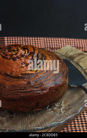Close-up of a chocolate or vanilla tiger or zebra cake made in layers forming black and white stripes Stock Photo