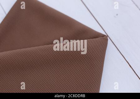 background texture of the fabric with a brown texture. fashion fabric Stock Photo