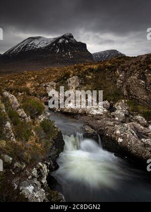 A small waterfall in front of Quinag. Stock Photo