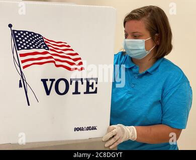 Reserve Officer Training Corps (ROTC) Cadet Alyssa Skorich sanitizes a voting station at the Anthony Stratton Building in Lawrenceburg, Ky., June 12, 2020. Skorich, a student at Eastern Kentucky University assigned to the 103rd Brigade Support Battalion in Harrodsburg, Ky., is part of the Kentucky Guard’s effort to assist the state’s on-going response to the COVID-19 pandemic. Stock Photo