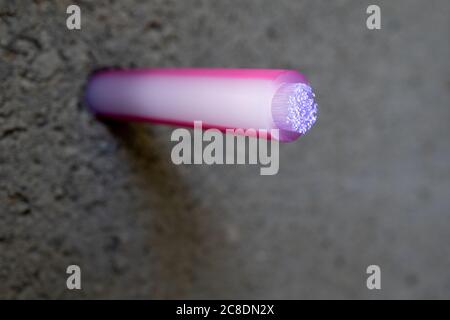 luminous fiber optic cable for fast Internet. Free space for text. Stock Photo