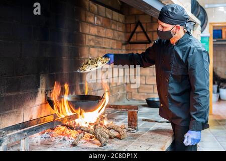 Traditional cooking of spanish food in restaurant kitchen Stock Photo