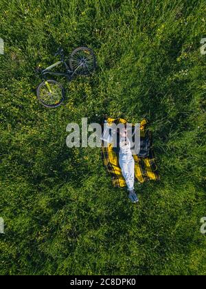 Aerial view of woman lying in the field of wheat Stock Photo - Alamy