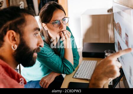 Young architects couple working at home Stock Photo
