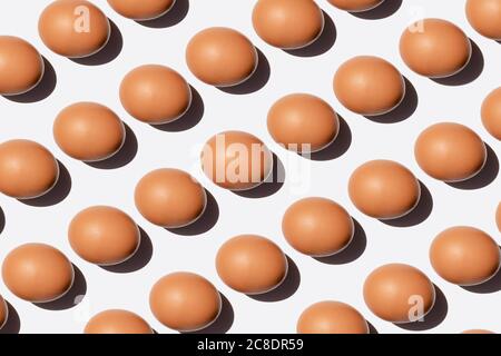 Pattern of chicken eggs against white background Stock Photo