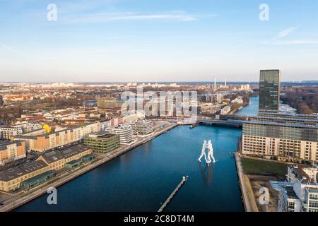 Germany, Berlin, Aerial view of Molecule Man sculpture standing in middle of river Spree canal Stock Photo