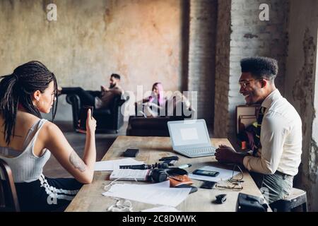 Creative team having business meeting in loft office Stock Photo
