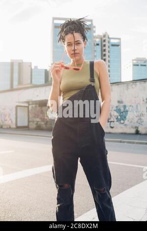 Look at my new heels Full lenght of attractive young woman in smart casual  wear posing against grey background and looking happy 13546260 Stock Photo  at Vecteezy