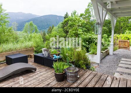 Terrace of holiday home with view to mountain range, Reichenwies, Oberammergau, Gerrmany Stock Photo