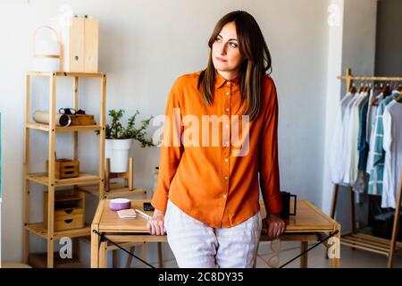 Portrait of female fashion designer in home office Stock Photo