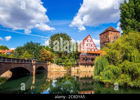 Germany, Bavaria, Nuremberg, Maxbrucke over Pegnitz river with Weinstadel in background Stock Photo