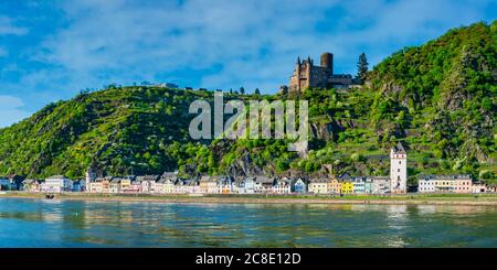 Germany, Rhineland-Palatinate, Sankt Goarshausen, Panorama of Katz Castle overlooking riverside town below Stock Photo