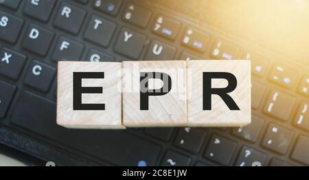 ERP Enterprise Resource Planning on wood cubes on computer keyboard. Stock Photo