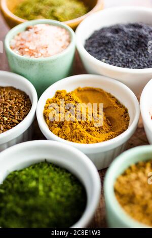 Bowls of assorted seeds and spices Stock Photo