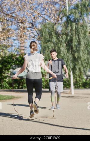 Coach with jump rope Stock Photo - Alamy