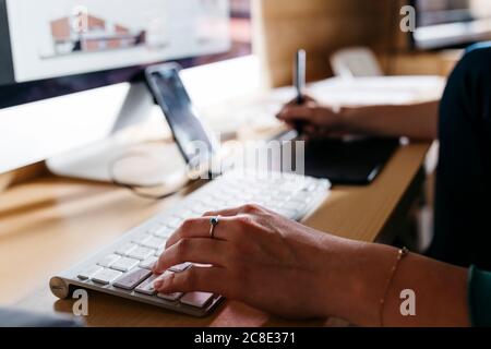 Female architect using computer at home Stock Photo