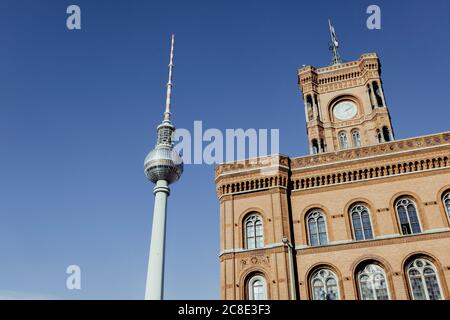Germany, Berlin, Mitte, Town hall (Rotes Rathaus) and television tower at Alexanderplatz Stock Photo
