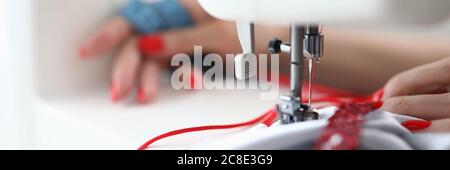 Detailed picture of seamstress at work Stock Photo