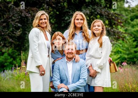 King Willem-Alexander, Queen Maxima and princesses Amalia, Alexia and Ariane are seen at the garden of Paleis Huis ten Bosch during the traditional photo session.King Willem-Alexander and his family received the media at the gardens of Paleis Huis ten Bosch for the traditional photo session as the summer holidays of his three daughters begin. Stock Photo