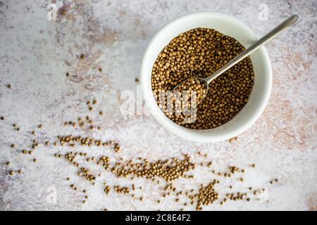 Bowl of coriander seeds Stock Photo