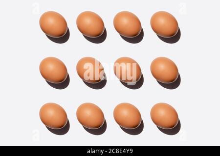 Pattern of chicken eggs against white background Stock Photo