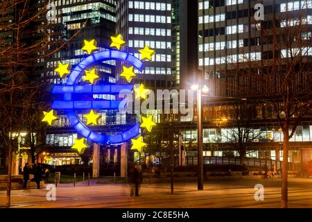 Germany, Hesse, Frankfurt, Euro Sculpture at dusk Stock Photo