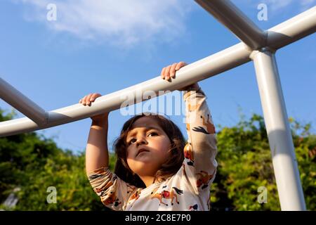 Portrait of little girl on playground Stock Photo