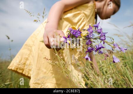 girls-hand-holding-picked-