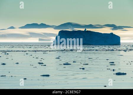 Icebergs floating in Hope Bay at dusk Stock Photo