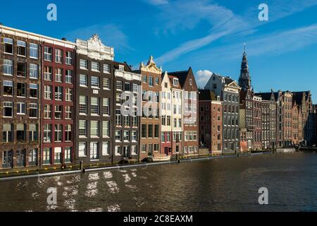 The Netherlands, North Holland Province, Amsterdam, Damrak, Port buildings Stock Photo