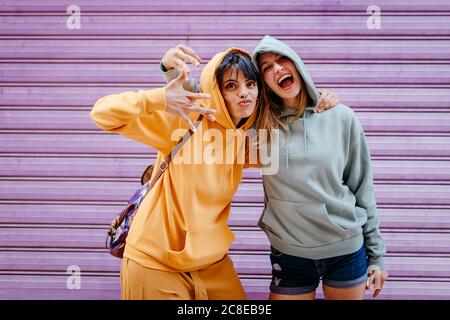 Portrait of two smiling and hugging female friends Stock Photo