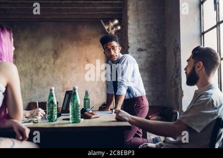 Creative team having business meeting in loft office Stock Photo