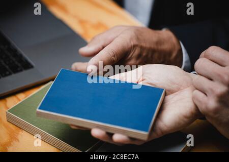 Hands of architects choosing colour samples in office Stock Photo