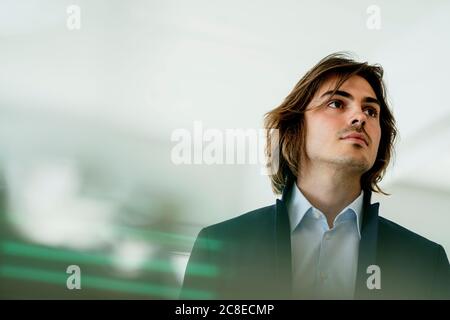 Close-up of thoughtful male professional looking away in cafe Stock Photo