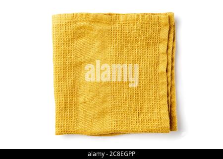 Folded yellow textile napkin on white Stock Photo