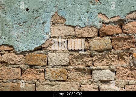 Plaster wall background with brick wall texture showing abstract graphic patterns in detail. Stock Photo