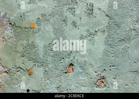 Plaster wall texture background abstract in soft green colour and rippled graphic patterns. Stock Photo