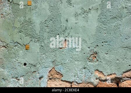 Plaster wall texture background abstract in soft green colour and rippled graphic patterns. Stock Photo