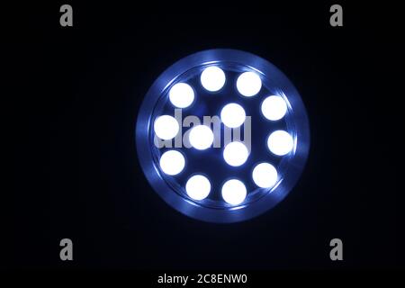 Head on view of a lit LED flashlight Stock Photo