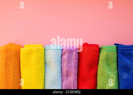 Close-up of five overlapping microfiber cleaning clothes of different colors. Top view. Cleaning service,tools. microfiber towels.Copy space Stock Photo