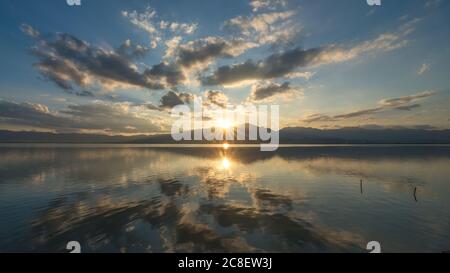 The scenery of the reflection of Kwan Phayao lake in sunset time in Phayao province, Thailand. Stock Photo