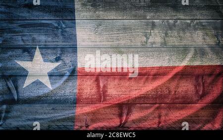 Texas state flag pattern on wooden board texture. Vintage style weathered background. Stock Photo