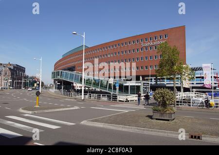 Town hall, municipal office or Stadskantoor in the center of Alkmaar. A modern building with an underpass for traffic. Netherlands, April Stock Photo