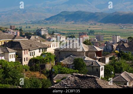 Gjirokastra or Gjirokaster, Albania.  Typical architecture in the old town.  Houses with stone roofs. Gjirokastra is a UNESCO World Heritage Site. Stock Photo