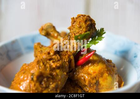 Indian Chicken Tikka Masala Recipe On Pieces Of White Onion Cucumber Carrot Chopped Parsley On A White Tray Stock Photo Alamy