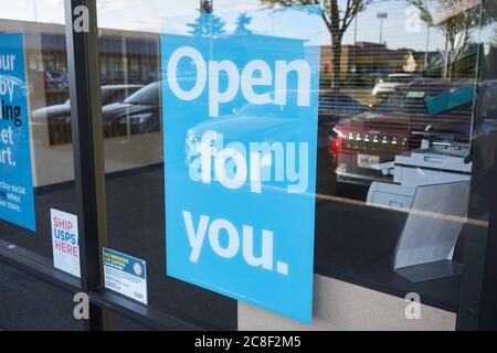 A big 'Open for you' sign is seen at a USPS (United States Postal Service) post office in Lake Oswego, Ore., on 7/22/2020, during the COVID-19 pandemic. Stock Photo