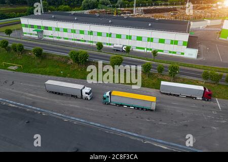 trucks waiting to be loaded at the logistics center top view Stock Photo