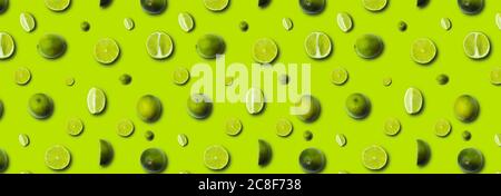 fresh slices lime on a light green background Stock Photo