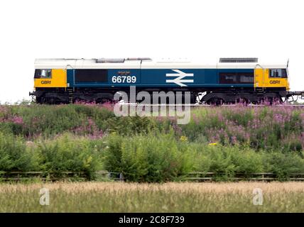 GBRf class 66 diesel locomotive No. 66789 'British Rail 1948-1997' pulling a freight train, Warwickshire, UK Stock Photo