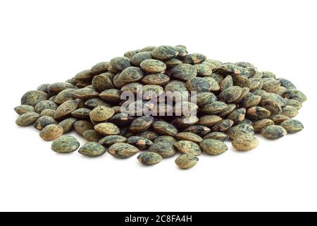 Heap of dry french green puy lentils isolated on white. Stock Photo